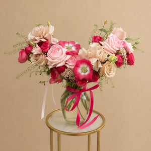 Sweet Devotion floral arrangement in a glass vase featuring pink roses, ranunculus, anemones, and seasonal blooms, available for same-day flower delivery in Orlando.