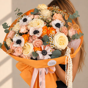 Golden Hour Bouquet — full view held by model