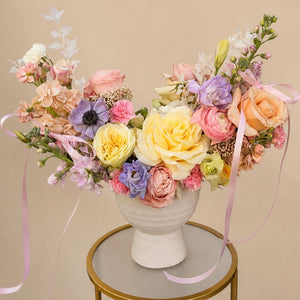 Garden Reverie flower basket with pastel roses, anemones, hydrangeas, and seasonal blooms by Floral Savour, available for same-day delivery in Orlando, Florida.