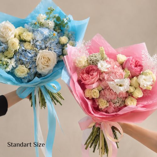 Baby Gender Reveal Bouquet Set with one blue and one pink luxury flower bouquet designed for gender reveal parties by Floral Savour Orlando.